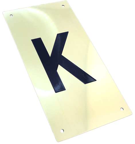 Tryckplåt, mässing, med symbol ''K'', svart fylld
